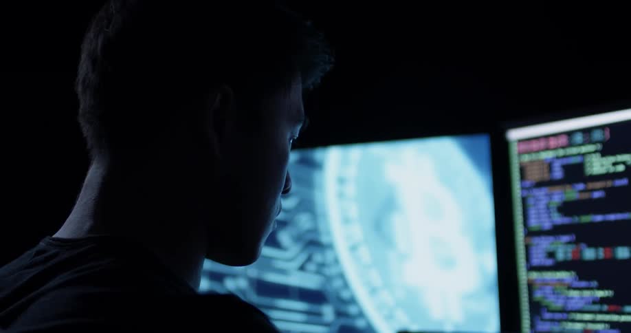 Man Coding On Computer In Dark Room