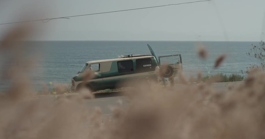 A man getting things out of the back of a van