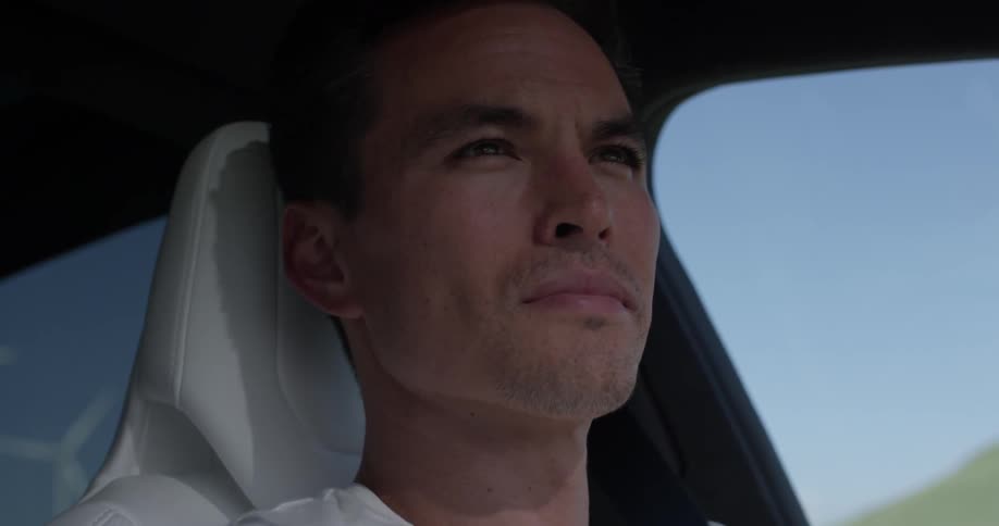 Man drives in his car in the afternoon