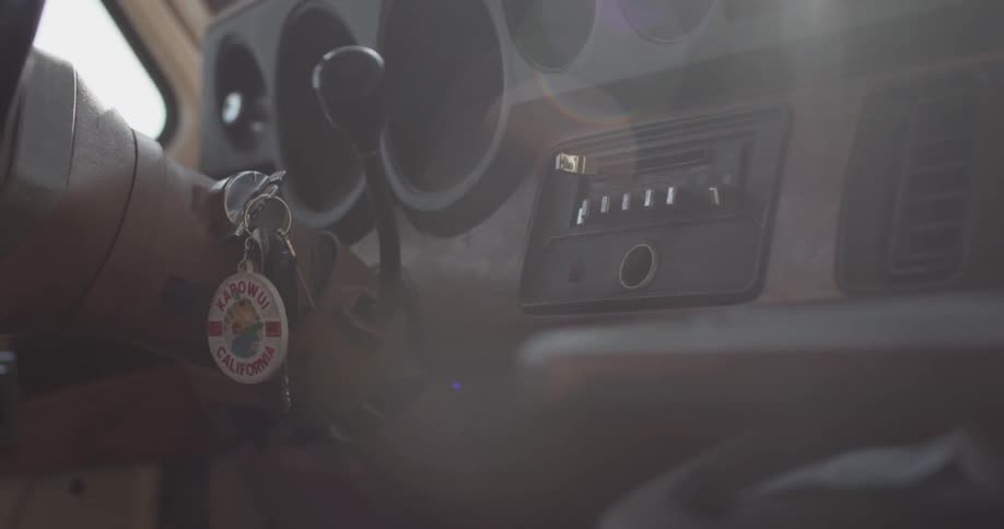 Keys hanging out of a car that is driving
