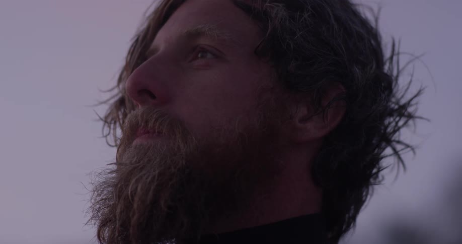 A man looks amazed as he looks around the scenery