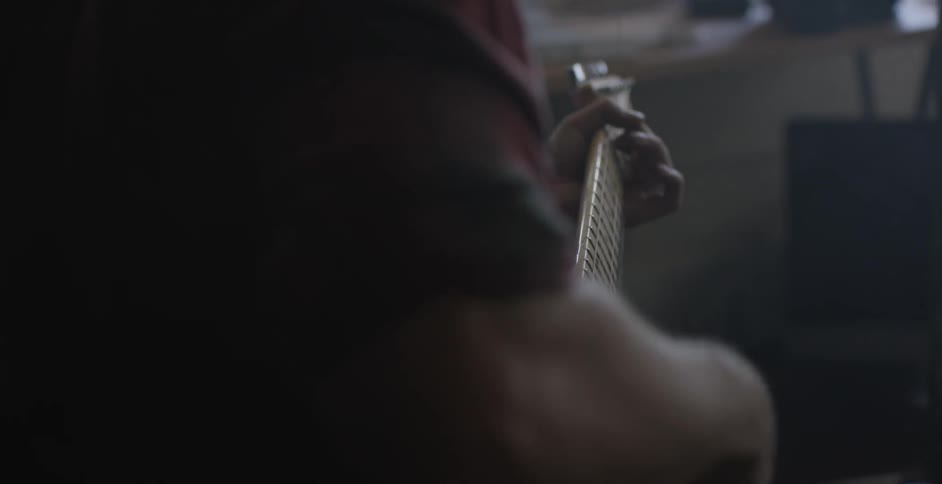 A man playing a guitar