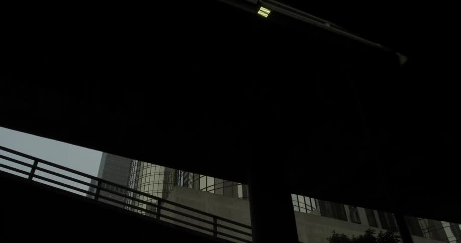 A tall building that is next to some roads
