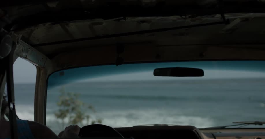 A person gets out of their vehicle