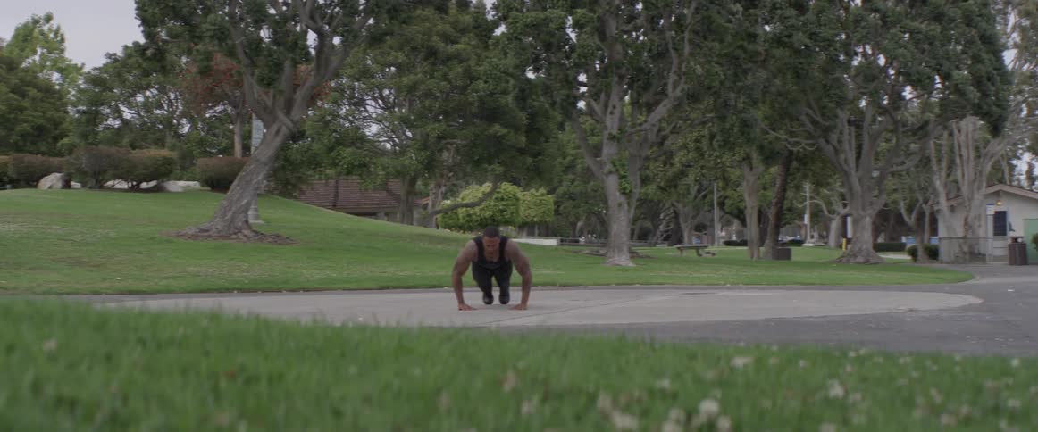 A man doing push ups on the ground