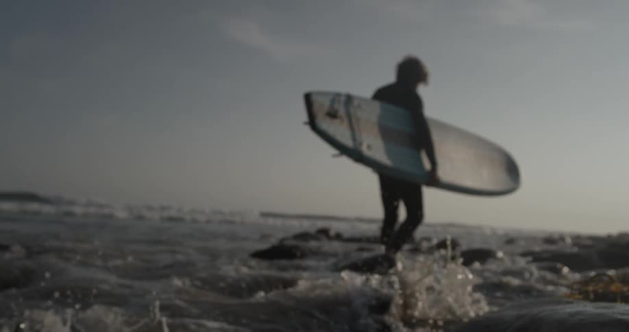 Man Driving To Beach And Surfing