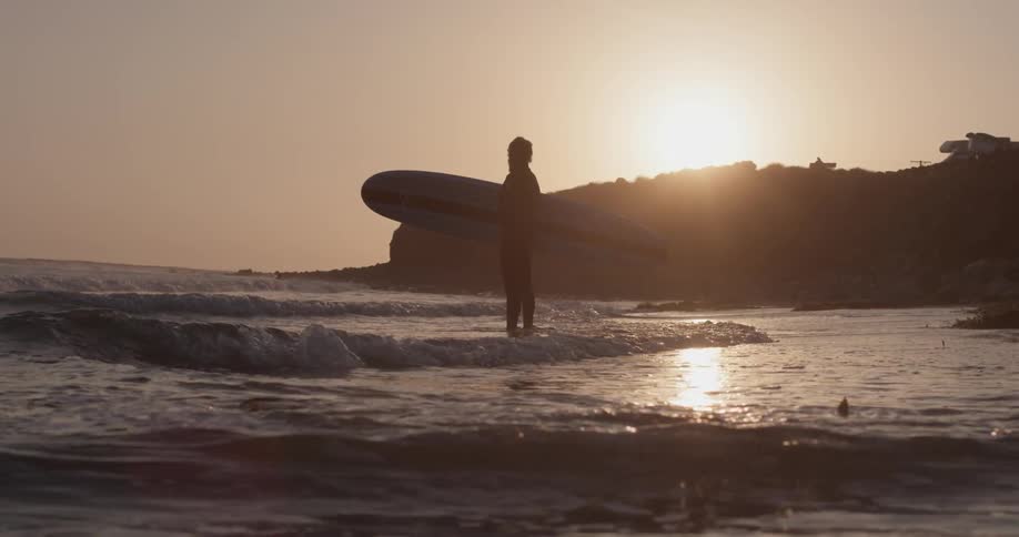 Man Driving To Beach And Surfing