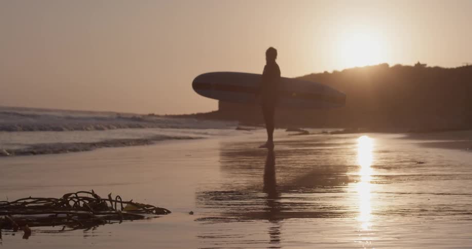 Man Driving To Beach And Surfing