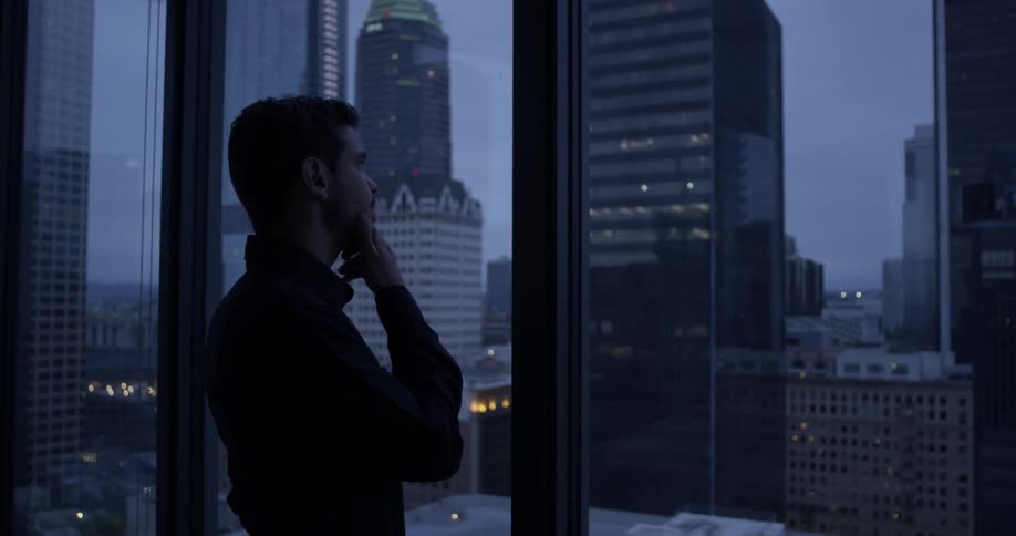 Man Inside High Rise Apartment