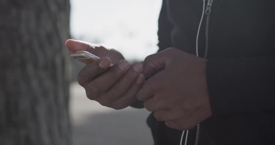 A man using a cellphone outdoors