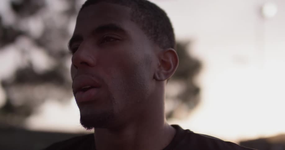 A man breathes heavy and then walks away