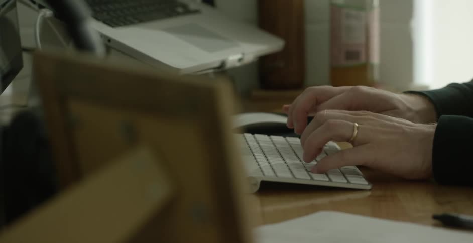 A man typing on a keyboard