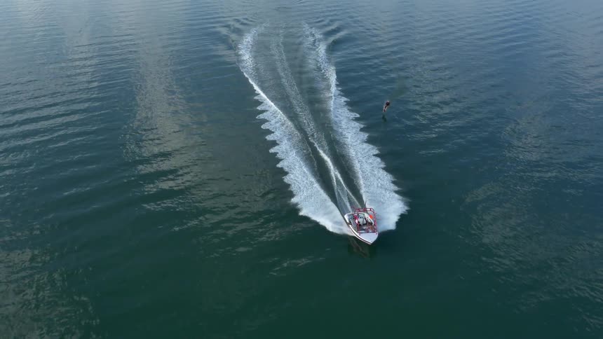 A person water skiing behind a boat