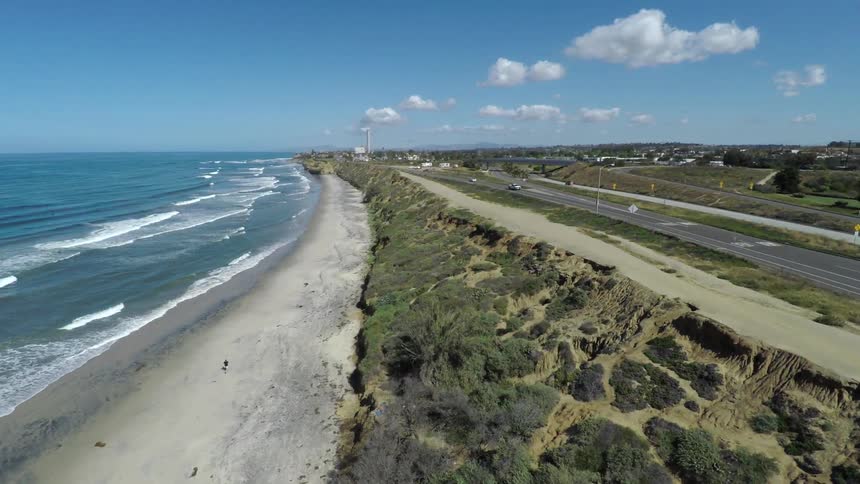 Ocean waves wash up onto a sandy beach