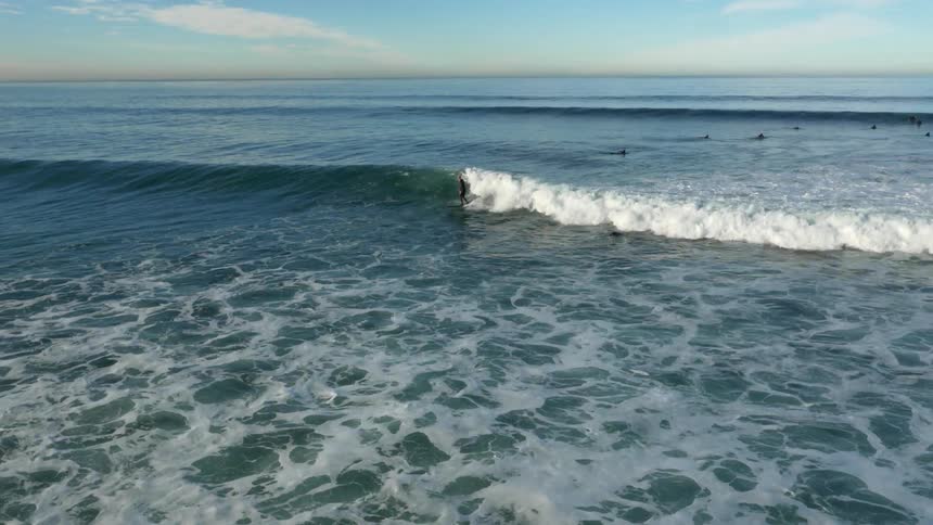 A surfer riding an ocean wave