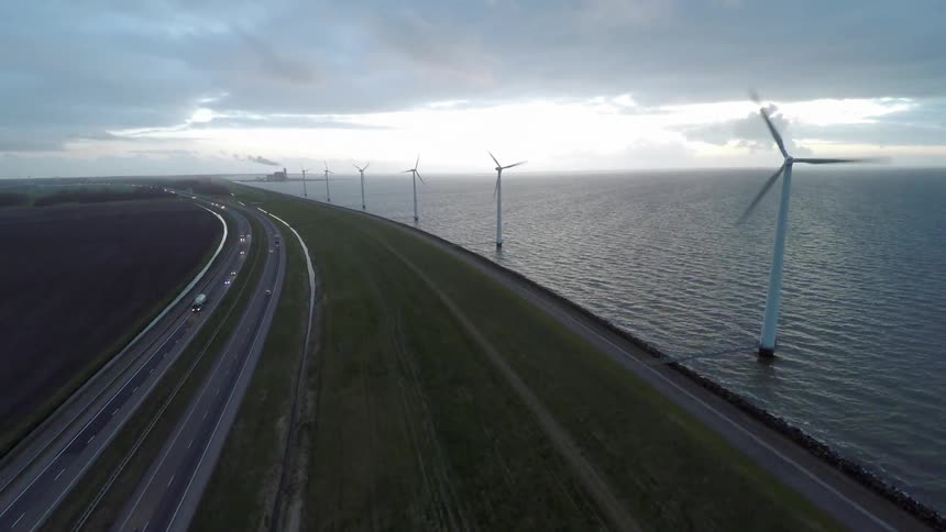 Windmills next to a highway