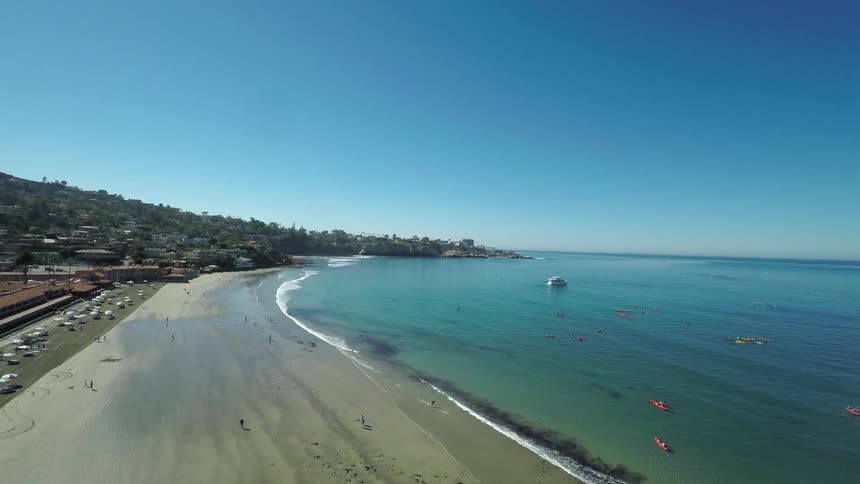 A beach is shown during the day