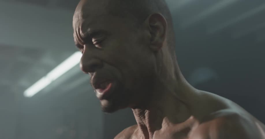 A man shrugs his shoulders and shakes his head quickly
