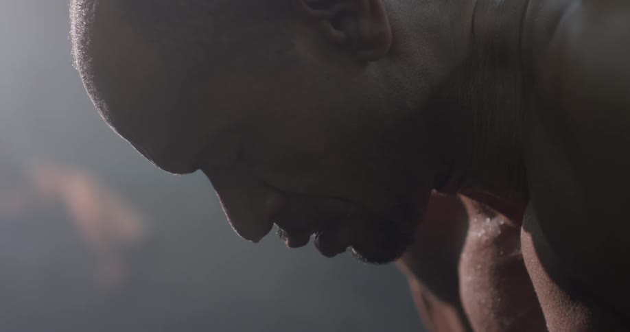 A man with his eyes closed putting his head down