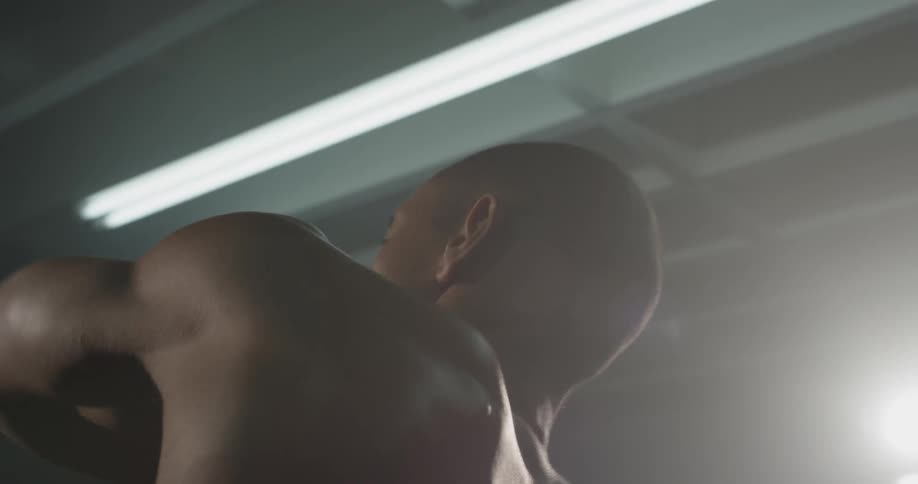 A man swings his arms from side to side