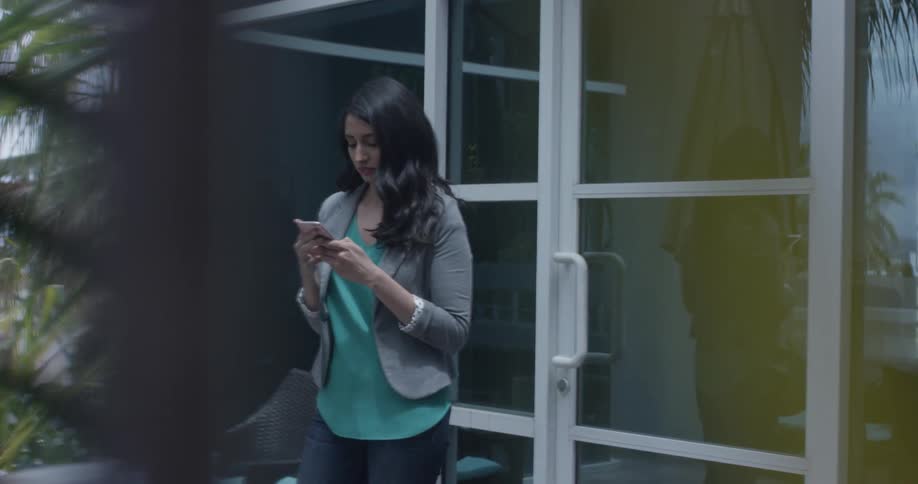 A woman reading something on her phone