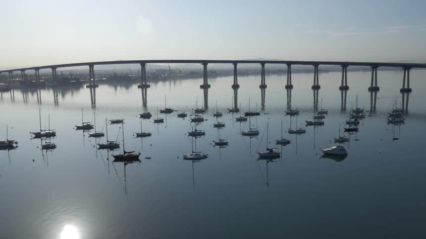 Boats floating on a body of water