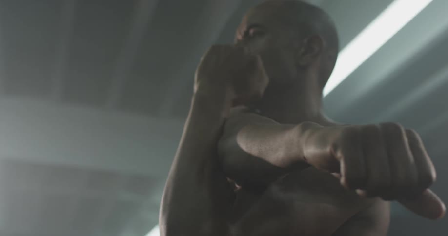 A man jumps and stretches his arm