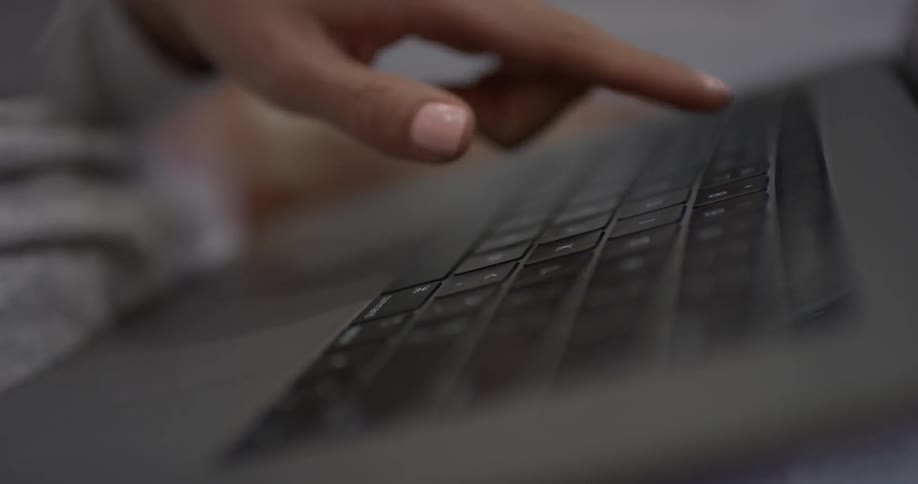 Woman typing on a keyboard