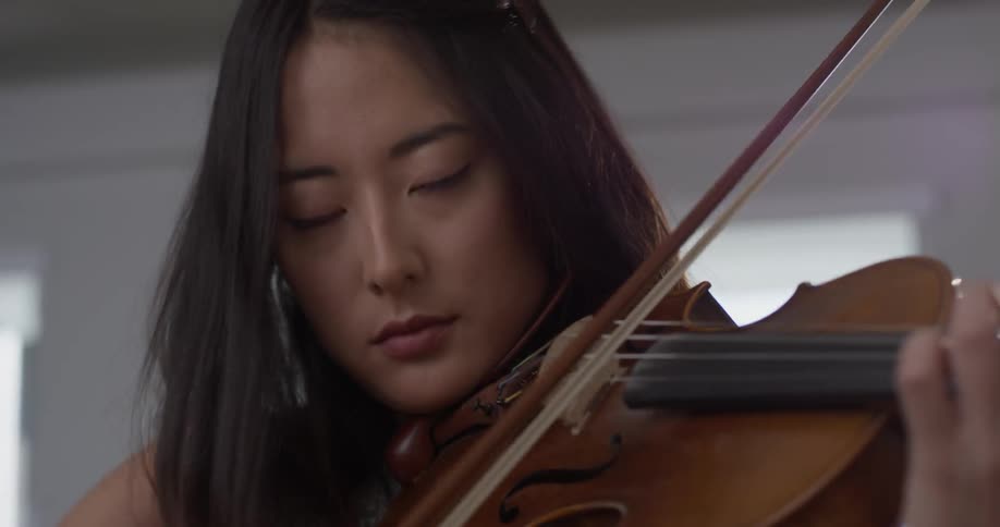 A woman playing the violin
