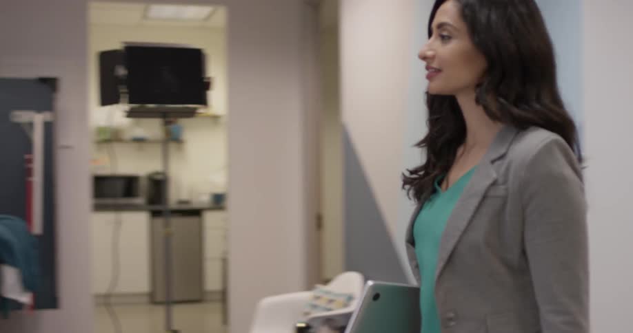 A woman is walking in a building