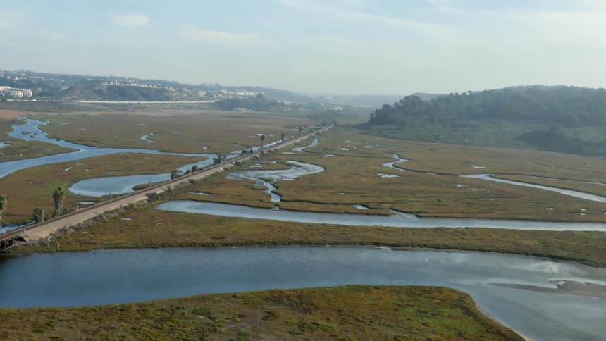 Water winding through a large field