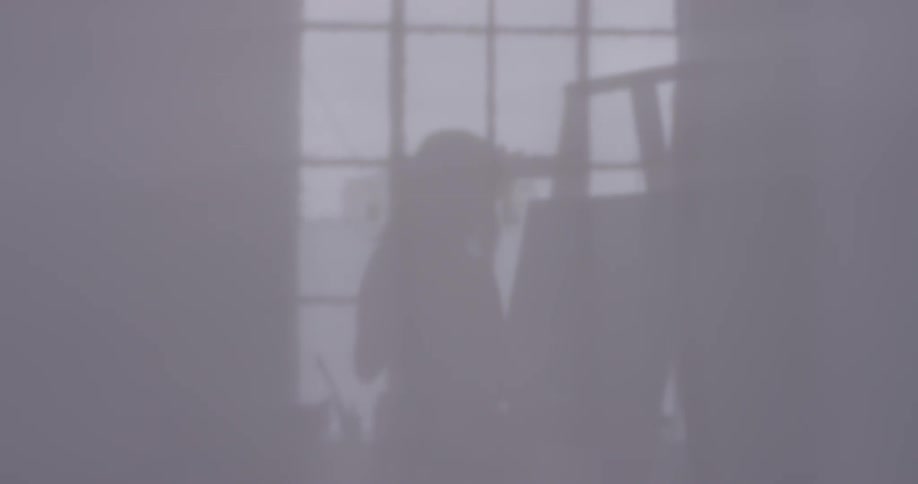 A woman looking at a canvas