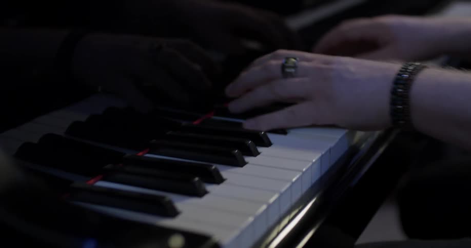 Man playing a song on a piano