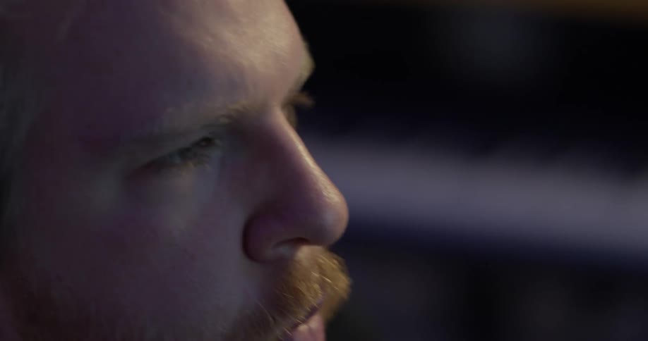 A man with a mustache moves to the beat
