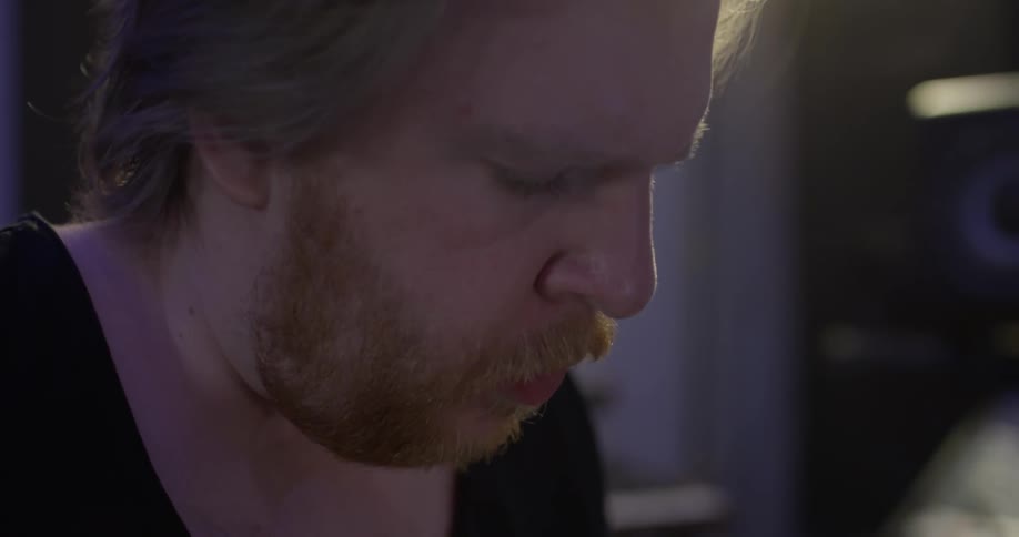 A man listening to music in a studio