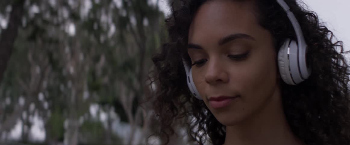 A woman looking at her phone outdoors