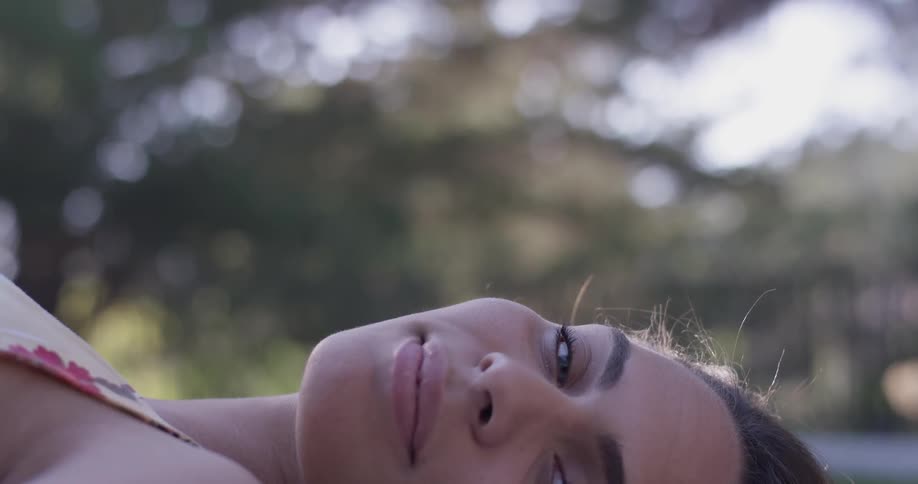 A woman laying down outdoors