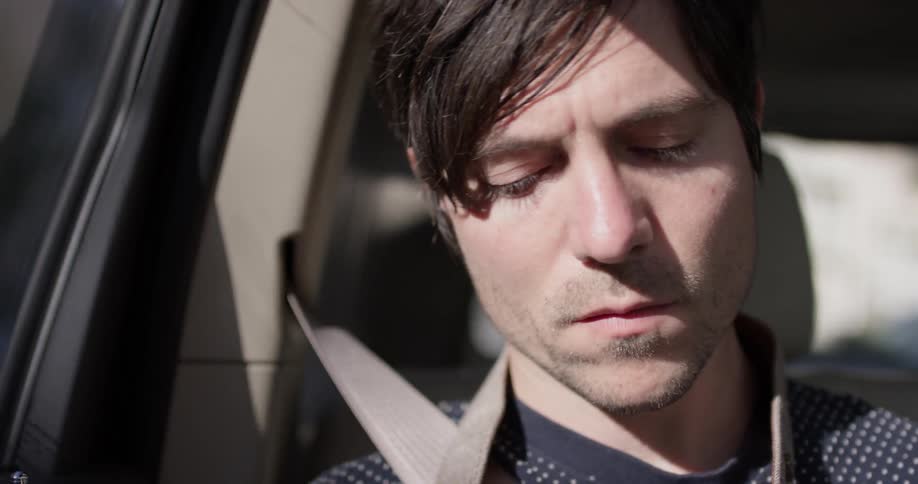 Man rides in passenger seat of car