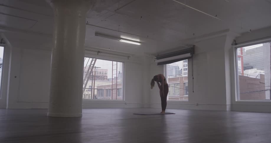 Woman is doing yoga indoors