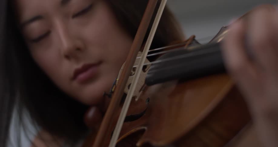 A woman playing a violin