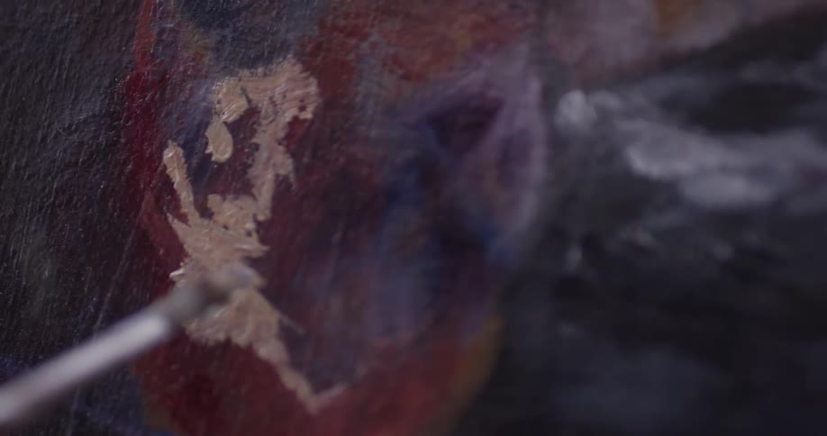 Someone is painting on a canvas