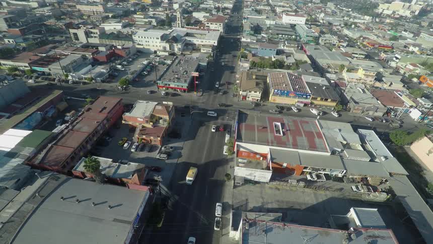 Aerial view of a small city with streets, warehouses and various buildings