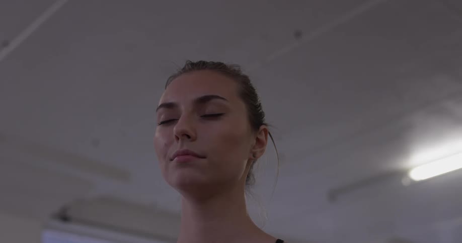 Woman Doing Yoga In Empty Building