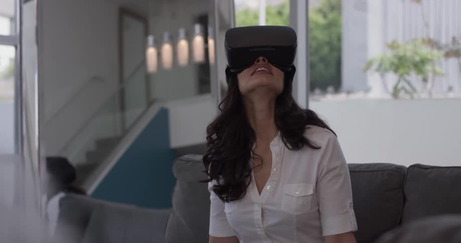 Woman In Apartment Using Electronics
