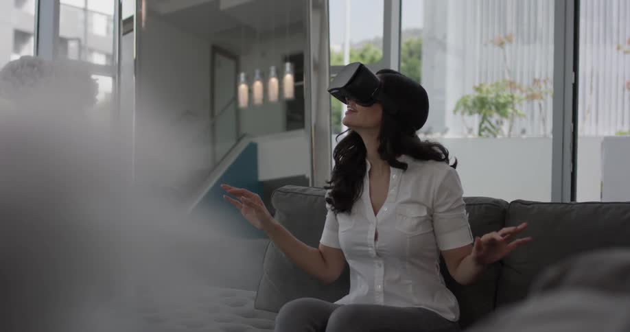 A woman is playing a video game inside