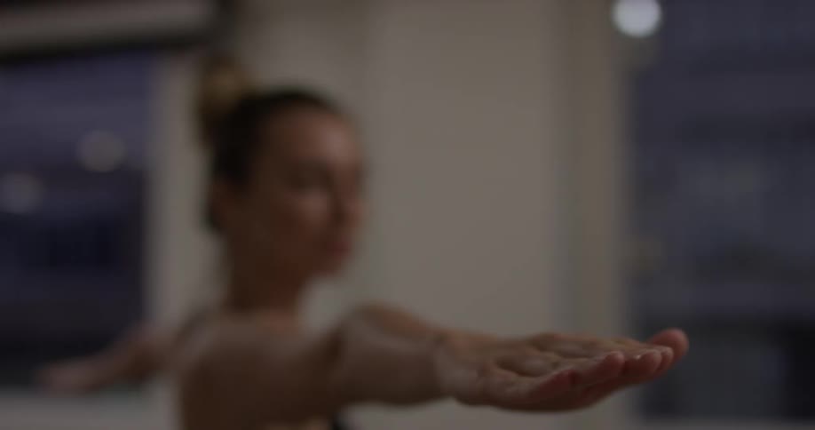Woman Doing Yoga In Empty Building