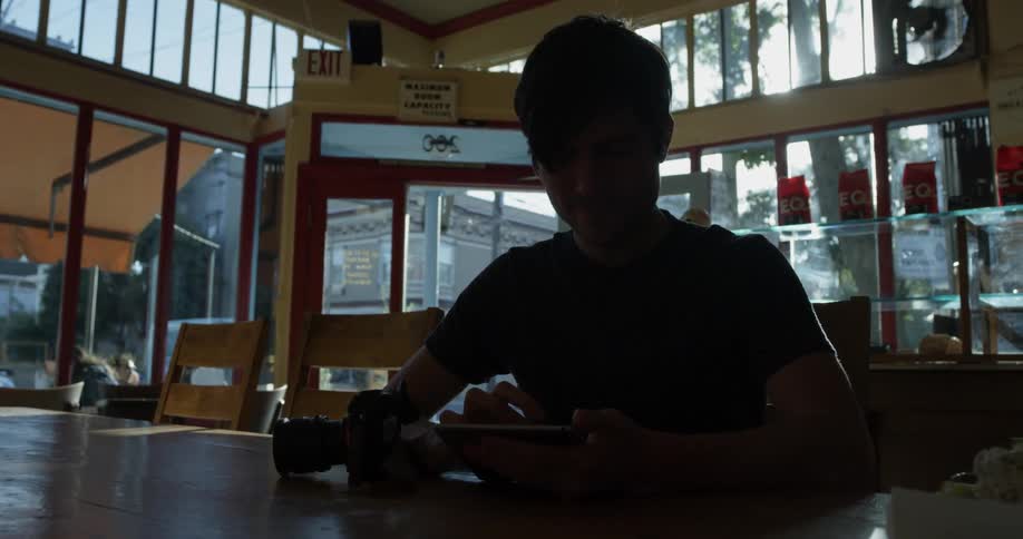 Person sits at a table in a school building