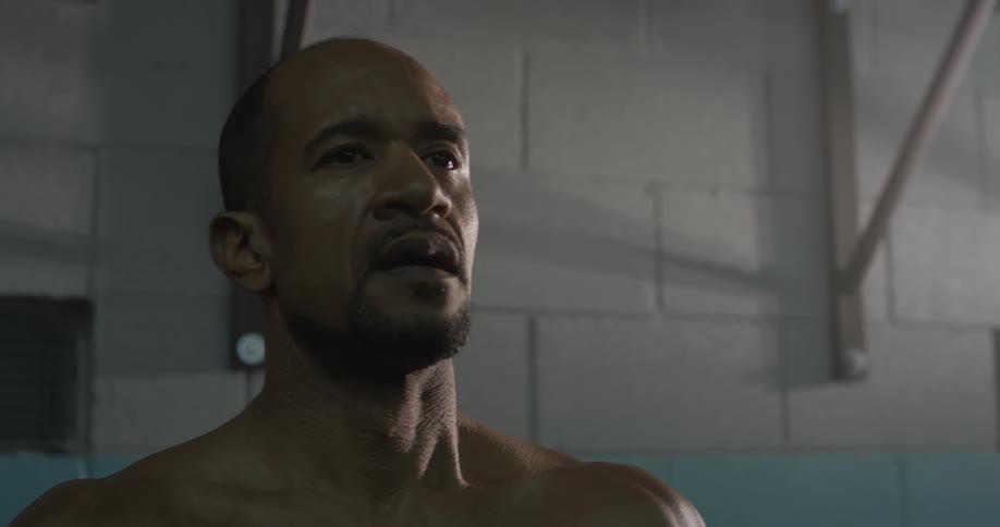 Man stands breathing heavily in a gum