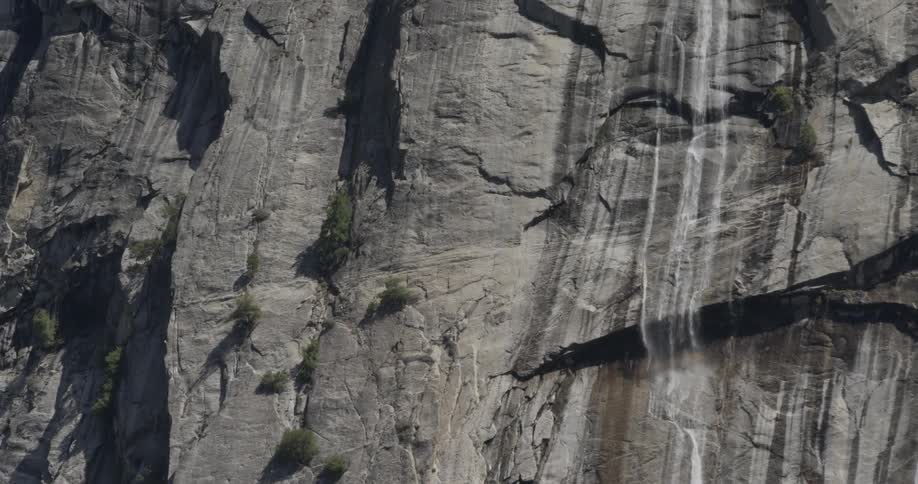 Waterfall trickles down a cliff
