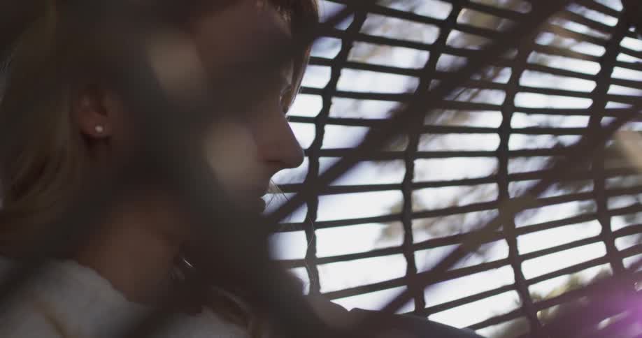 A woman is sitting in a swing